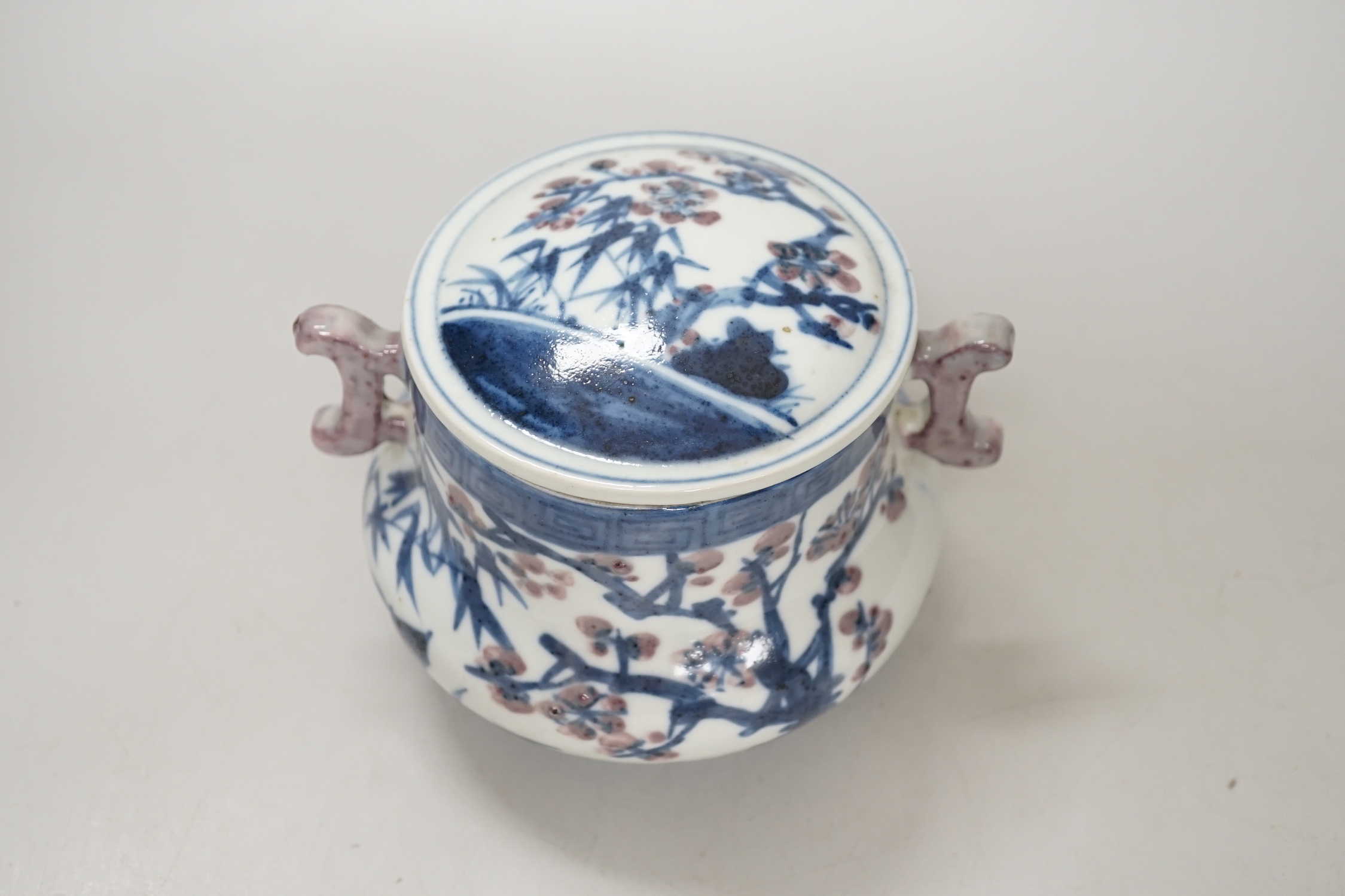 A Chinese underglaze blue and copper red pot and cover, 12cm high